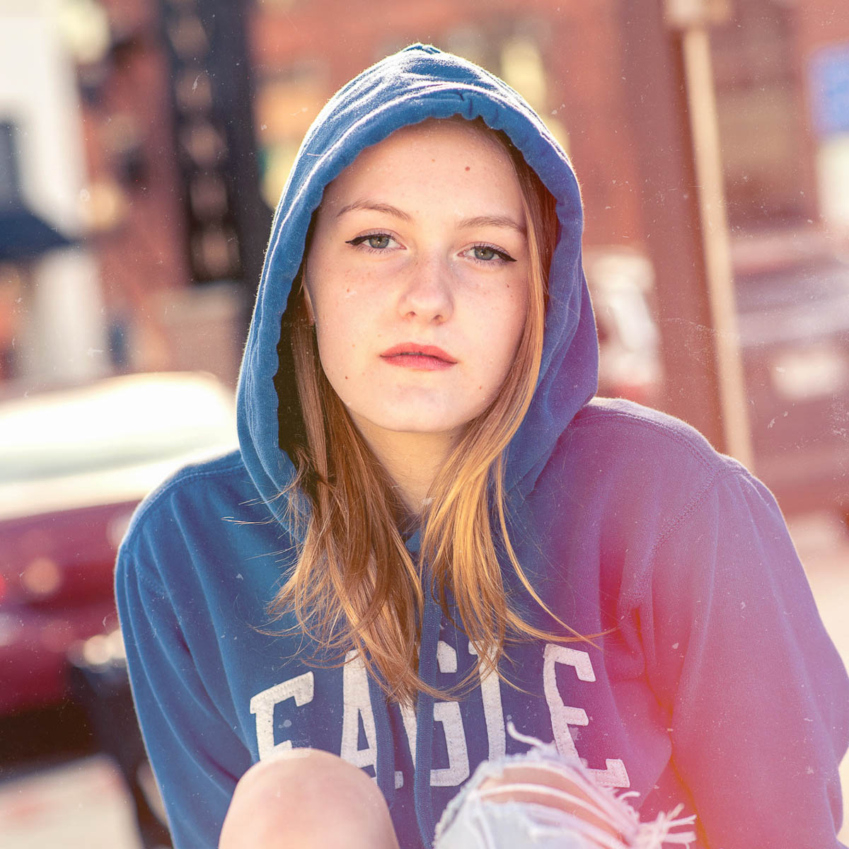 Family photography portfolio shot, warm portrait of parents with kids outdoors